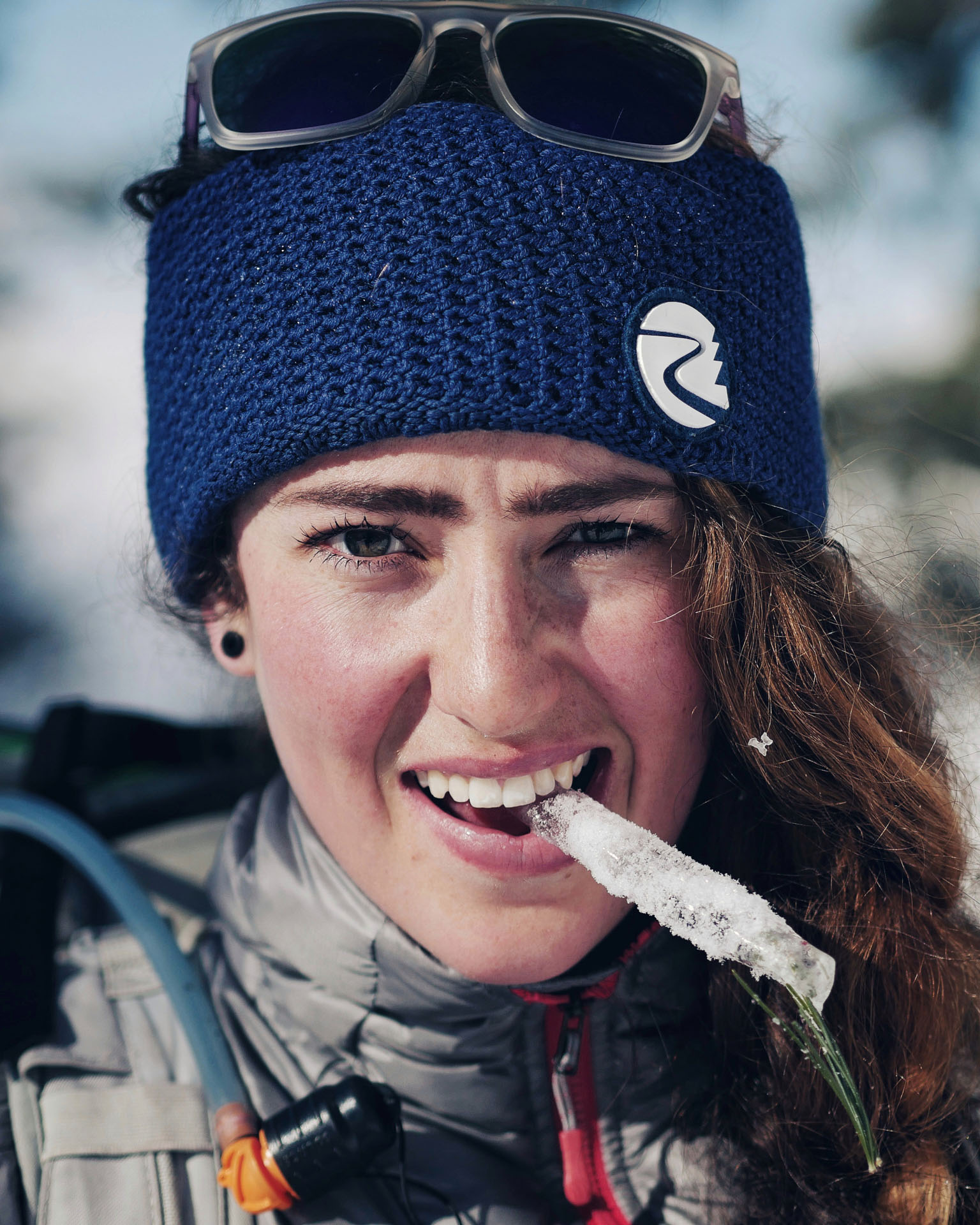 The outdoors woman Anja Jesch with an icile between her teeth.