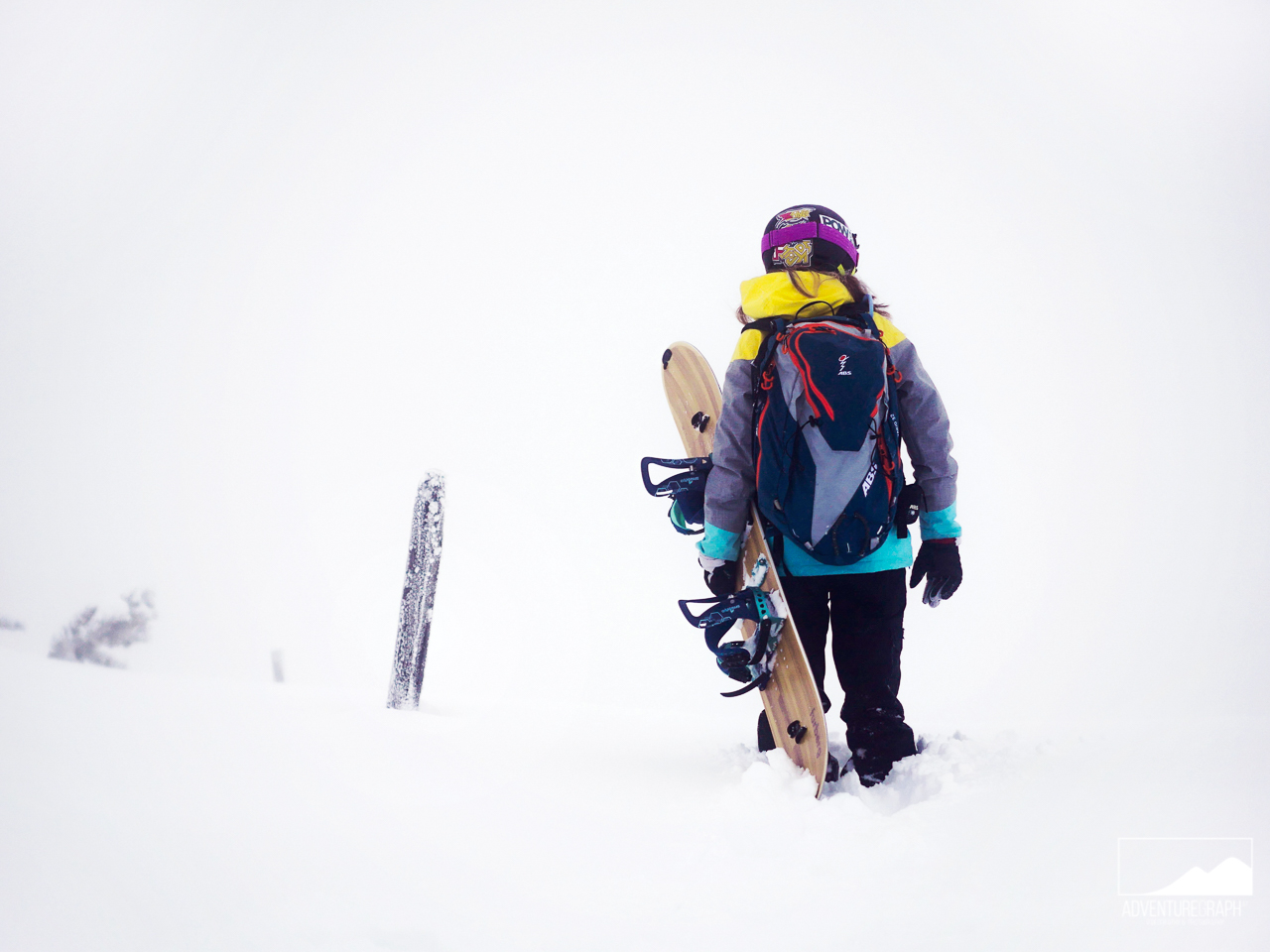 Spliboarding girl in the backcountry for freeride snowboarding near Innsbruck.