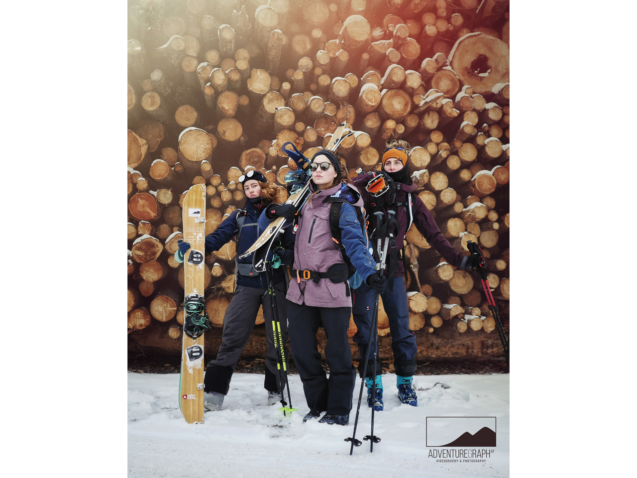 Ski touring girls with splitboards wear serious business faces.