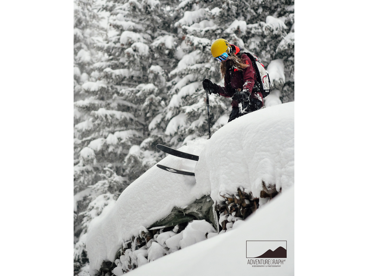 Freeride ski touring girl is outdoors in deep snow (powder) during holidays.